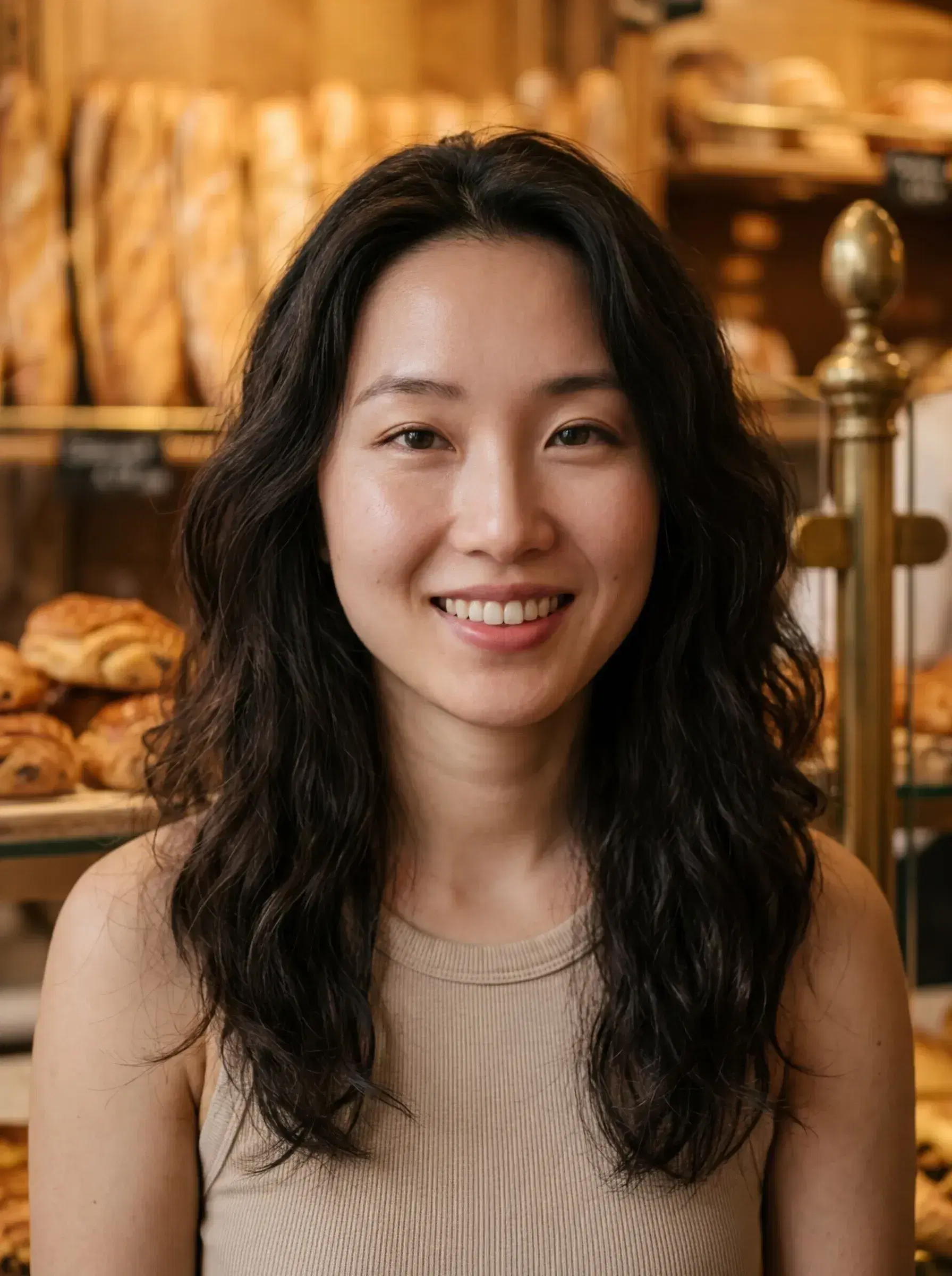 AI AI Paris Photos — Your Parisian Photoshoot from One Selfie — Candid portrait inside a warm Parisian boulangerie