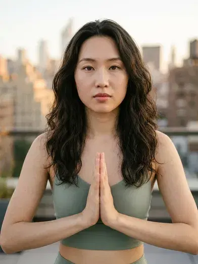 Rooftop yoga pose with city skyline background