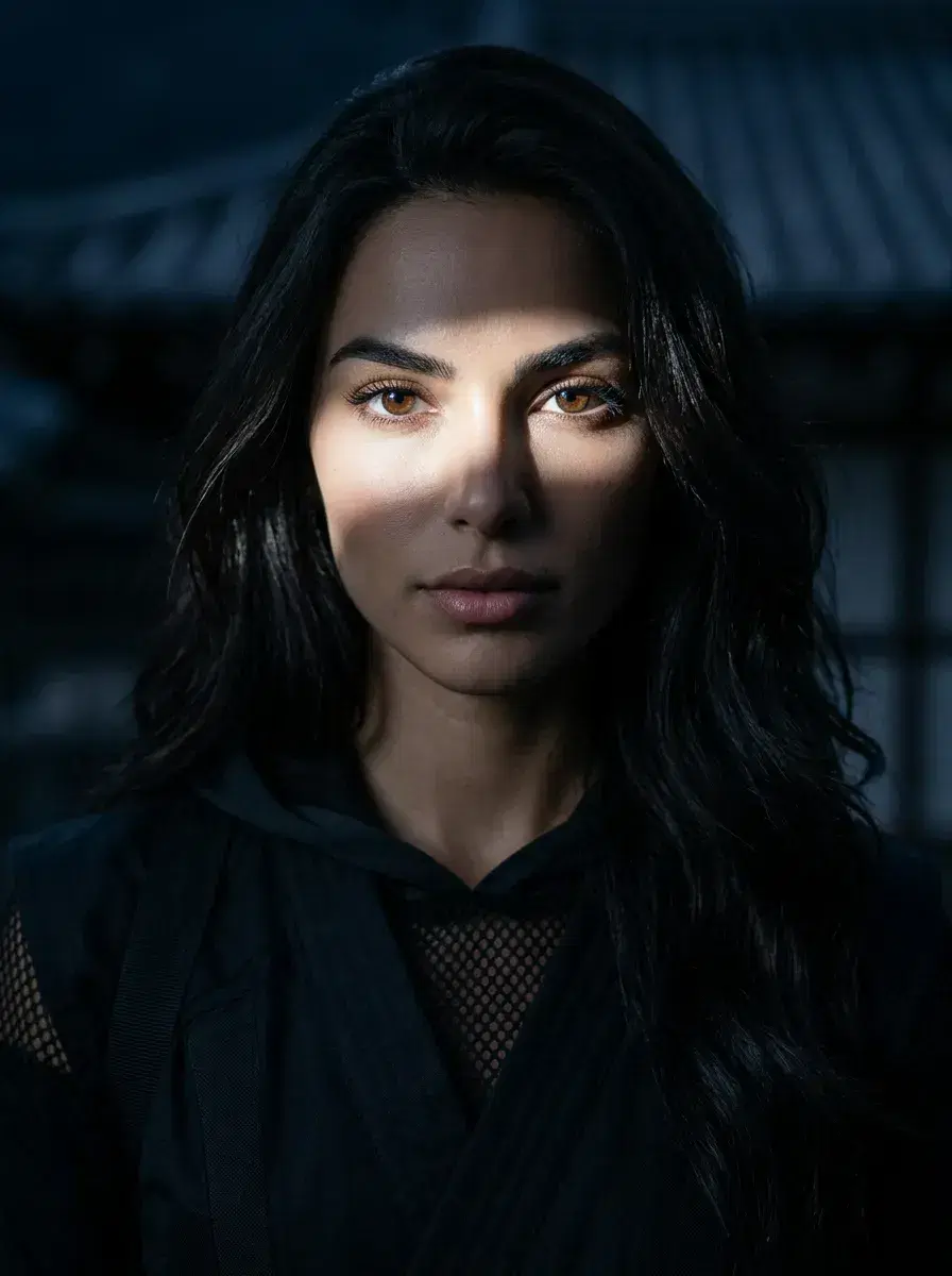 AI AI Anime Cosplay Photos — Character-Perfect — Close-up portrait of person in ninja anime outfit with dramatic moonlight